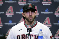 Newly acquired Arizona Diamondbacks pitcher Madison Bumgarner speaks after being introduced during a team availability, Tuesday, Dec. 17, 2019, in Phoenix. (AP Photo/Matt York)