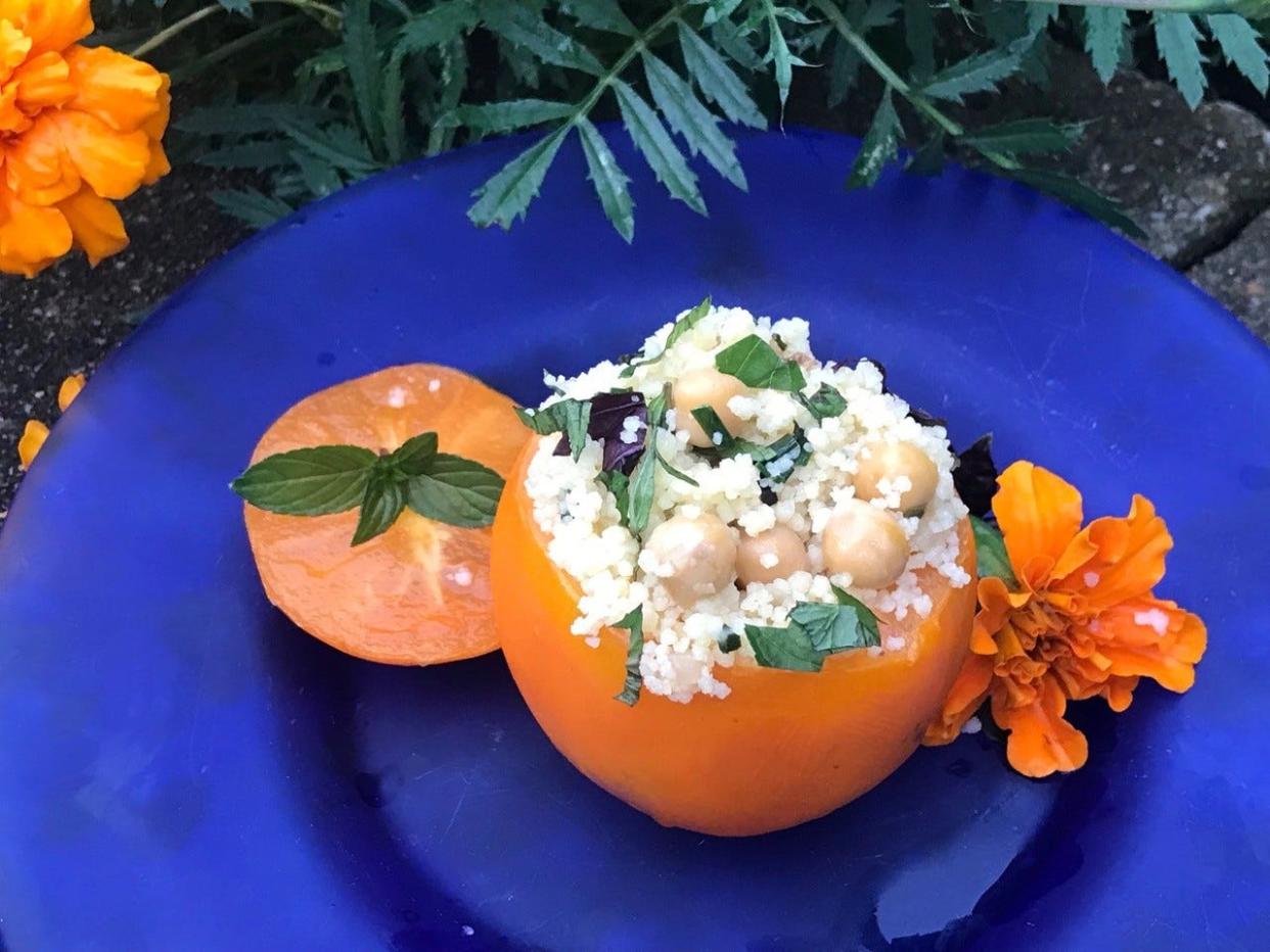 Couscous, chickpea and zucchini stuffed tomatoes