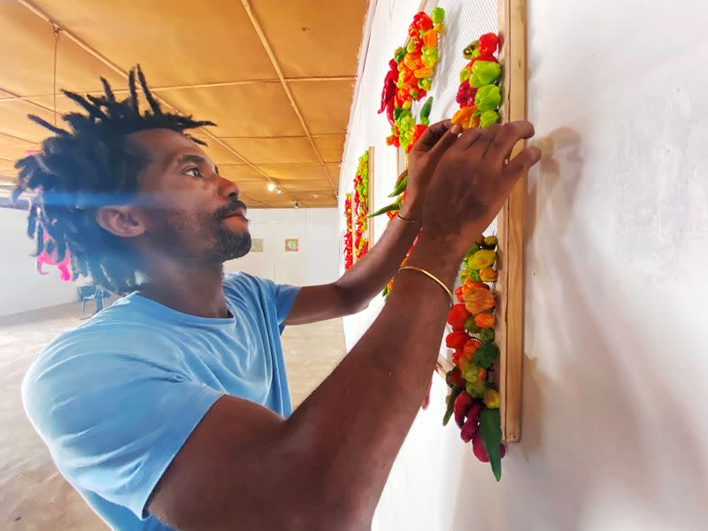 Nigerian artist Fela Keko sets up an exhibition of fresh pepper motive at a gallery in Iwaya, Lagos