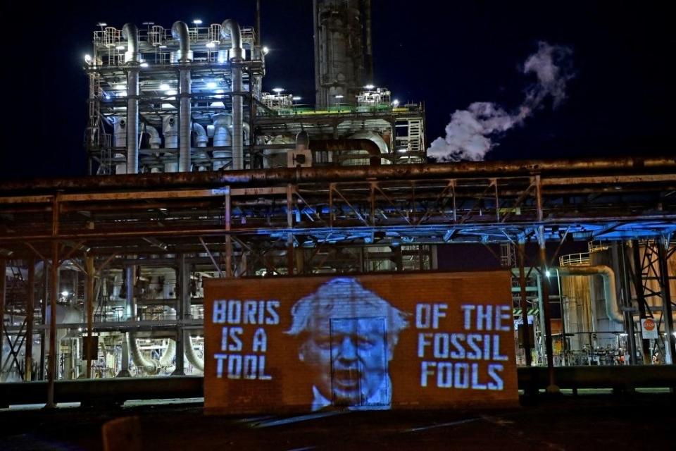 A banner that says "Boris Is A Tool Of The Fossil Fools"