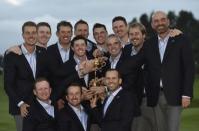 Team Europe golfers pose for a group photograph with the Ryder Cup after the closing ceremony of the 40th Ryder Cup at Gleneagles in Scotland September 28, 2014.REUTERS/Toby Melville