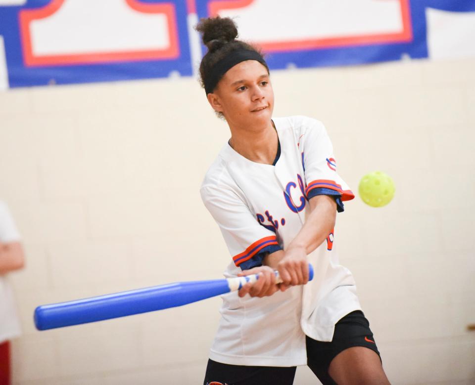 St. Cloud Crush sophomore Maria McKnight swings at a pitch Tuesday, May 17, 2022, at Apollo High School. 