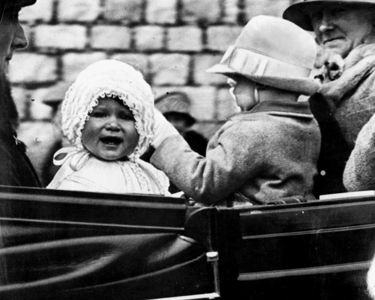 Princess Elizabeth is taken for a ride in the grounds of Windsor Castle, with her cousin, the honourable Gerald Lascelles, right, son of Princess Royal, in 1927.