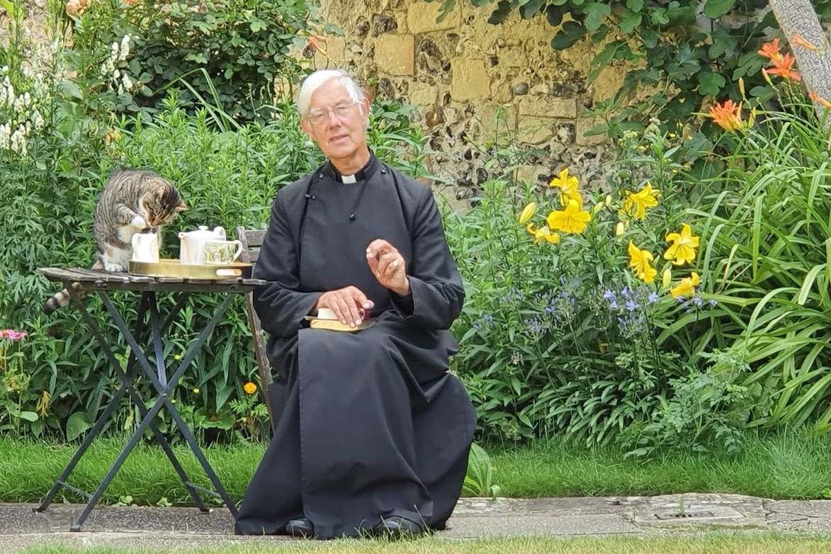 Tiger the cat stole milk from a jug as the Very Reverend Dr Robert Willis, Dean of Canterbury, lead a Monday morning online prayer service: PA
