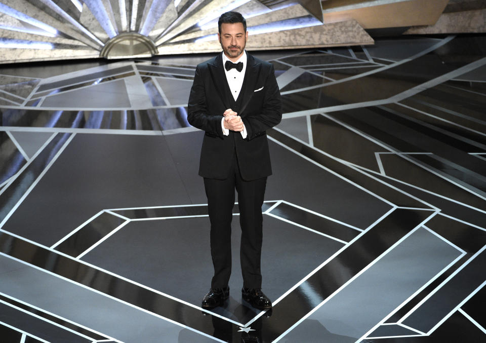 FILE - Host Jimmy Kimmel speaks at the Oscars in Los Angeles on March 4, 2018. Kimmel will again preside over the ceremony in March, the show’s producers said Monday. (Photo by Chris Pizzello/Invision/AP, File)