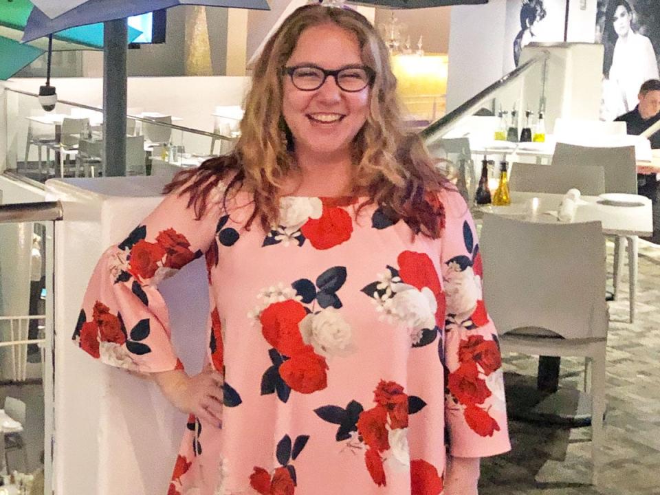 Jamie Allison Sanders smiling in pink patterned dress