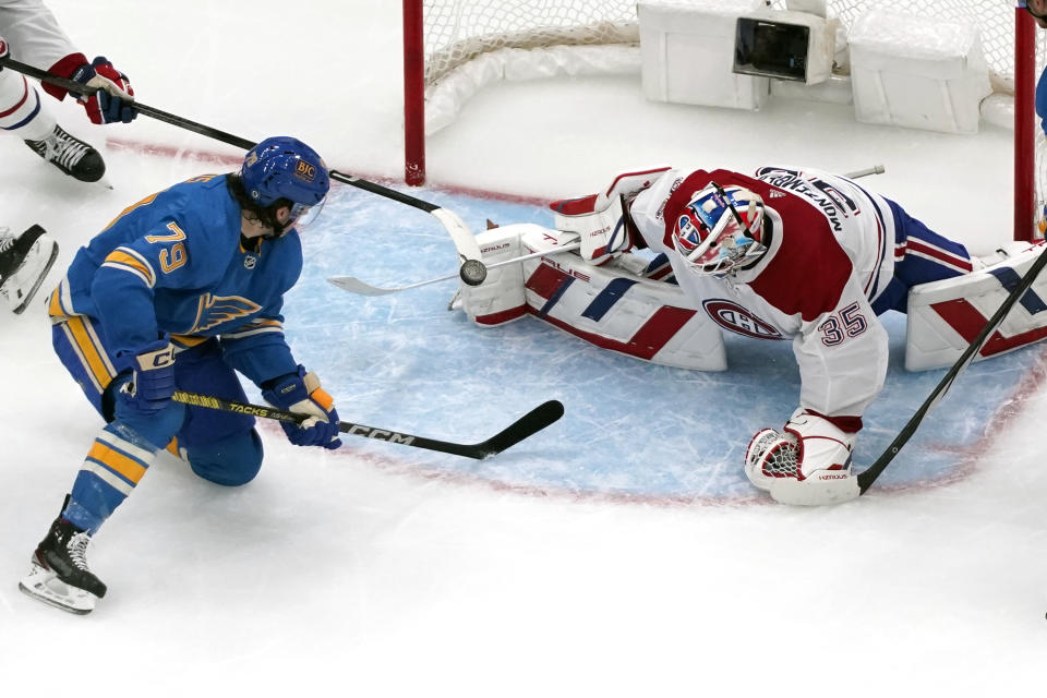 Montreal Canadiens goaltender Sam Montembeault (35) stops an attempt by St. Louis Blues' Sammy Blais (79) during the third period of an NHL hockey game Saturday, Nov. 4, 2023, in St. Louis. (AP Photo/Jeff Roberson)