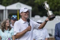 Steve Stricker hoists the trophy on the 18th hole after winning the Regions Tradition, a PGA Tour Champions golf event, Sunday, May 15, 2022, in Birmingham, Ala. (AP Photo/Vasha Hunt)