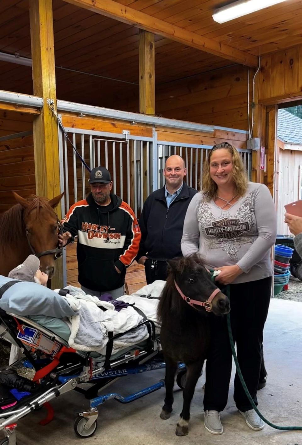 A family brought their elderly mother to visit Deep Pond Farm in Taunton to fulfill her last wish to see horses on Sept. 29, 2023. The moving moment was shared on social media by Brewster Ambulance. With her that day are, standing from left, Deep Pond owner Georges Ghazal; Brewster Ambulance Team Member Sean Lambrecht; and Georges Ghazal's wife Melissa Ghazal. The horses are Amari and Sable.