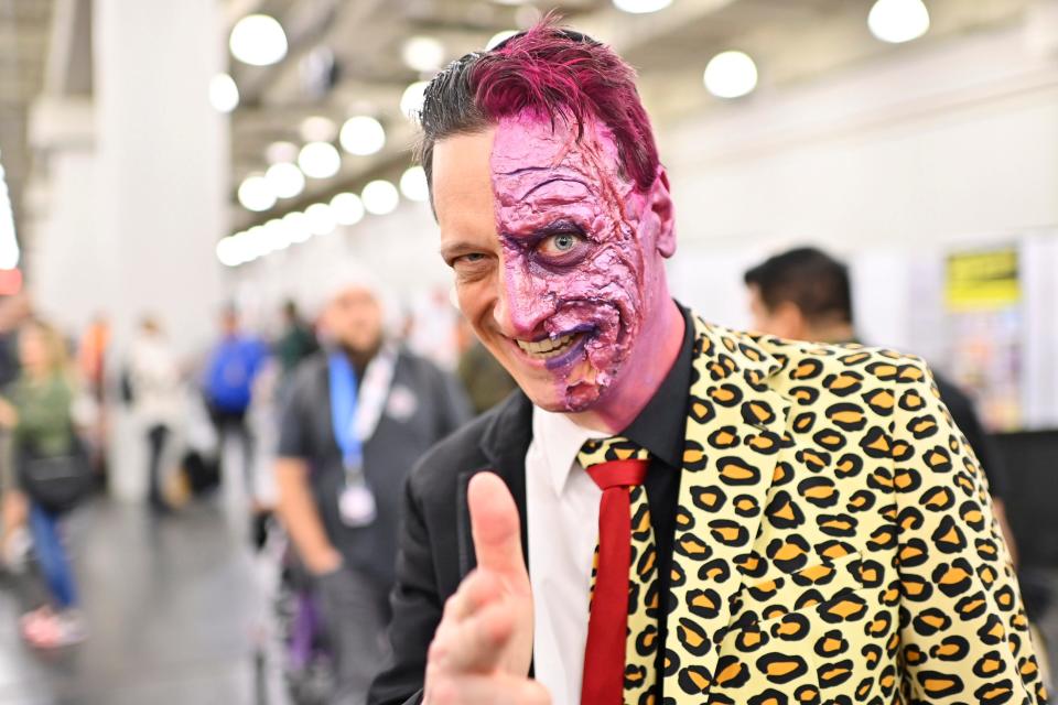 A cosplayer dressed as Two-Face at New York Comic Con 2022.