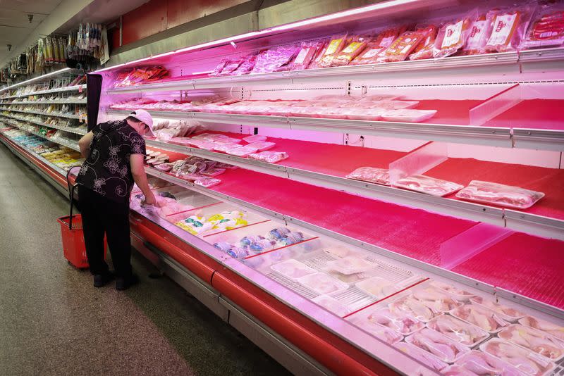 A person shops for meat in a supermarket in Manhattan, New York City