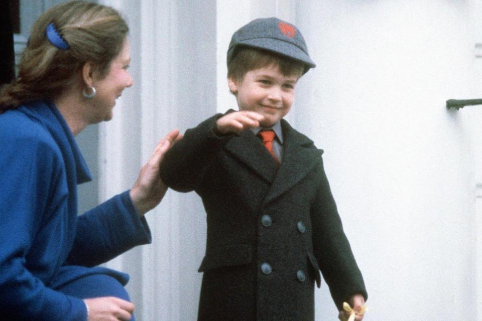 Prince William waves at onlookers after his first day at his new school, Wetherby School in Notting Hill (PA)