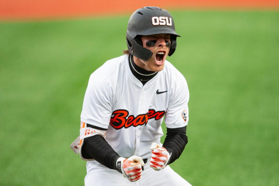 Oregon State's Travis Bazzana (37) celebrates after hitting the team's second solo home run during an NCAA college baseball game against Oregon at Goss Stadium on Friday, April 26, 2024, in Corvallis, Ore.