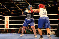 <p>Katie Walsh, left, connects with a blow off Stacy Weinstein during the NYPD Boxing Championships at the Theater at Madison Square Garden on June 8, 2017. (Photo: Gordon Donovan/Yahoo News) </p>