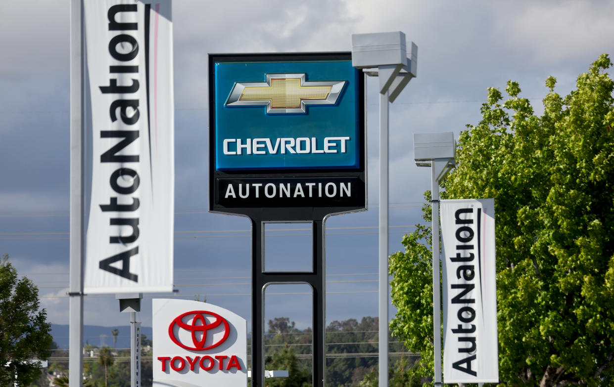 VALENCIA, CALIFORNIA - APRIL 21: Signs are displayed at an AutoNation Chevrolet car dealership on April 21, 2022 in Valencia, California. The auto retailer released quarterly earnings today showing that revenue increased 14 percent to $6.75 billion, beating Wall Street expectations, amid continued strong demand for new and used vehicles. (Photo by Mario Tama/Getty Images)