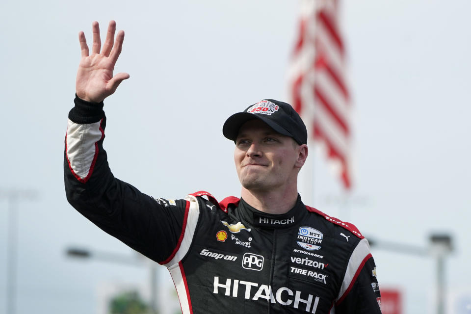 Josef Newgarden waves after winning the IndyCar Series auto race Saturday, July 23, 2022, at Iowa Speedway in Newton, Iowa. (AP Photo/Charlie Neibergall)