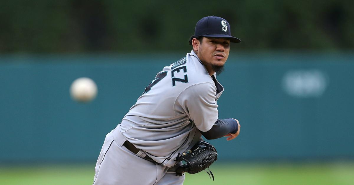 Seattle Mariners pitcher Felix Hernandez runs his hand over his