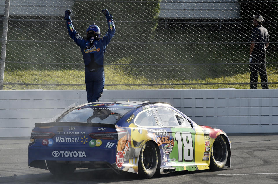 Kyle Busch celebrates after winning a NASCAR Cup Series auto race, Sunday, July 29, 2018, in Long Pond, Pa. (AP Photo/Derik Hamilton)