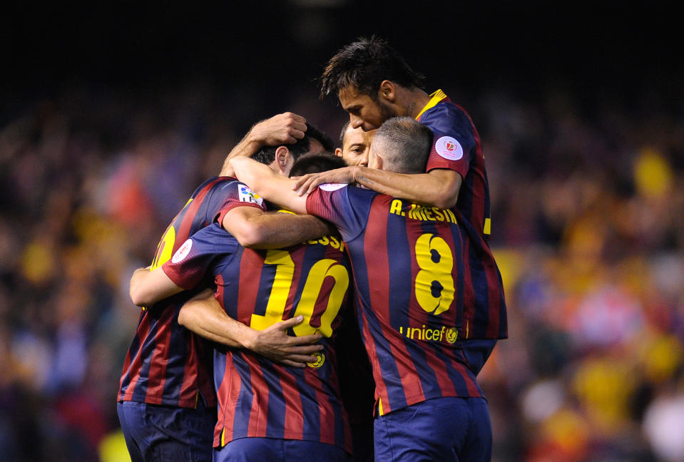 Barcelona's players celebrate after Marc Bartra scored his side's first goal during the final of the Copa del Rey between FC Barcelona and Real Madrid at the Mestalla stadium in Valencia, Spain, Wednesday, April 16, 2014. (AP Photo/Manu Fernandez)