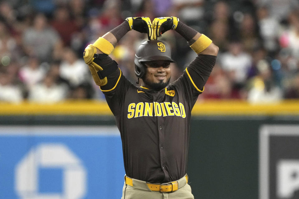 San Diego Padres' Luis Arraez reacts after hitting a double against the Arizona Diamondbacks in the first inning during a baseball game, Friday, Sept. 27, 2024, in Phoenix. (AP Photo/Rick Scuteri)