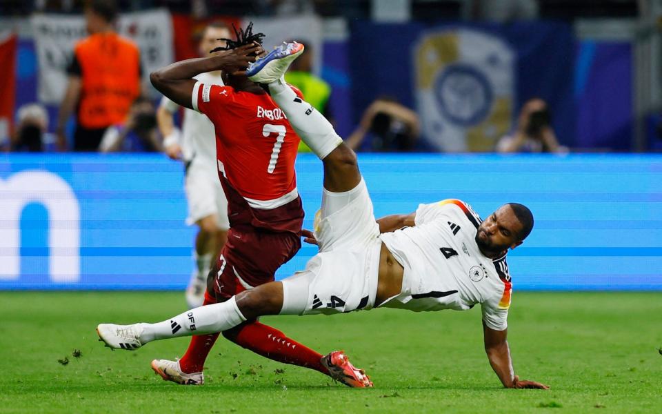 Jonathan Tah fouls Breel Embolo