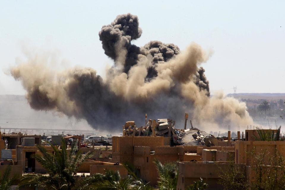 Smoke rises from the last besieged neighborhood in the village of Baghouz, Deir Al Zor province, Syria, (REUTERS)