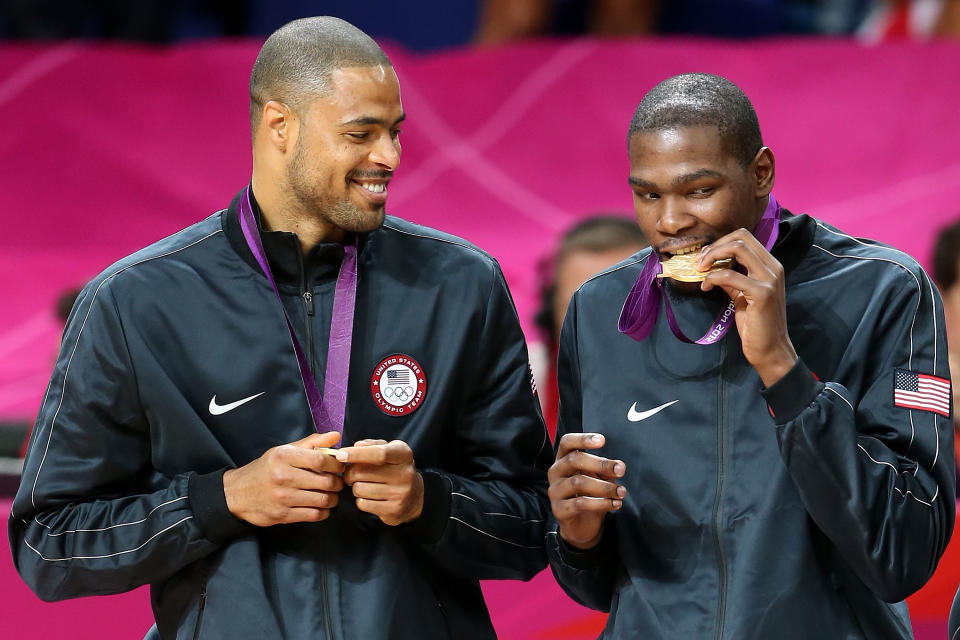 LONDON, ENGLAND - AUGUST 12: Gold medallists Tyson Chandler #4 of the United States and Kevin Durant #5 of the United States celebrate on the podium during the medal ceremony for the Men's Basketball on Day 16 of the London 2012 Olympics Games at North Greenwich Arena on August 12, 2012 in London, England. (Photo by Streeter Lecka/Getty Images)