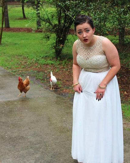Rude of this girl to photobomb these chickens’ prom pic.
