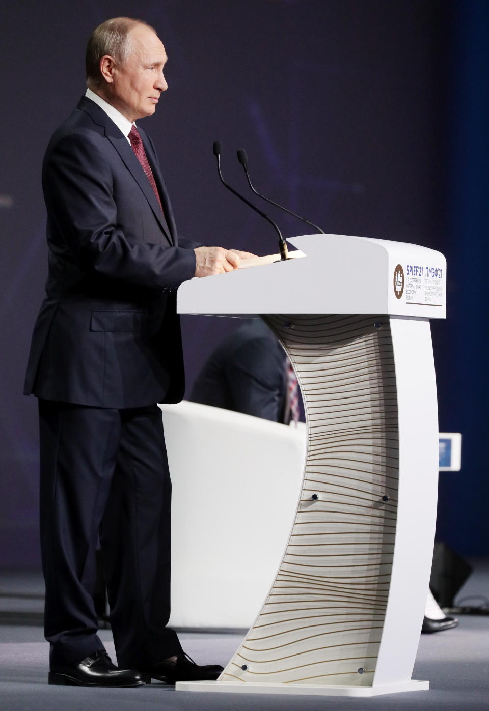 Russian President Vladimir Putin speaks at the St. Petersburg International Economic Forum in St. Petersburg, Russia, Friday, June 4, 2021. Russian President Vladimir Putin on Friday praised his country's response to the COVID-19 pandemic and called for a stronger global response to global warming. (Vladimir Smirnov/TASS News Agency Pool Photo via AP)