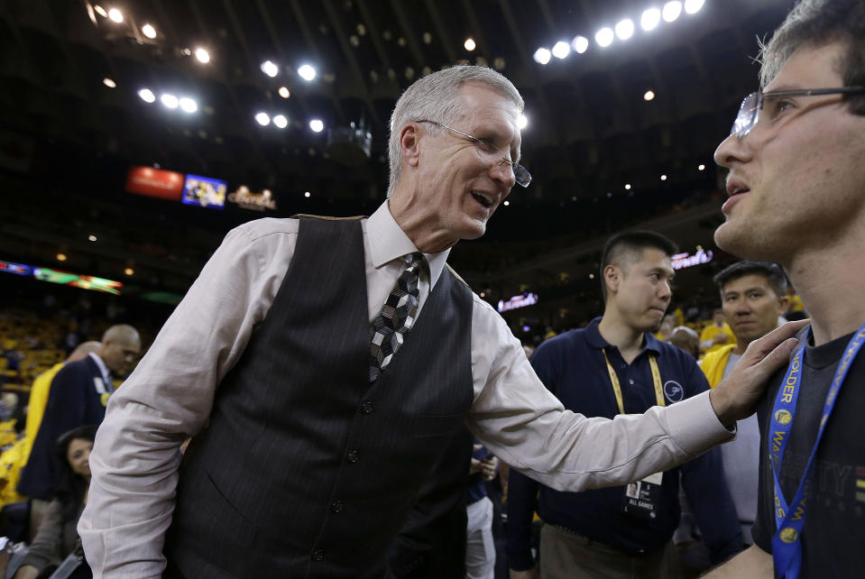 FILE - Mike Breen, NBA play-by-play sports commentator for ABC, greets fans before Game 1 of basketball's NBA Finals between the Golden State Warriors and Cleveland Cavaliers on June 4, 2015, in Oakland, Calif. Breen will hit his 100th NBA Finals broadcast on Monday night, June 12, 2023, during game 5 between the Miami Heat and Denver Nuggets. (AP Photo/Ben Margot, File)