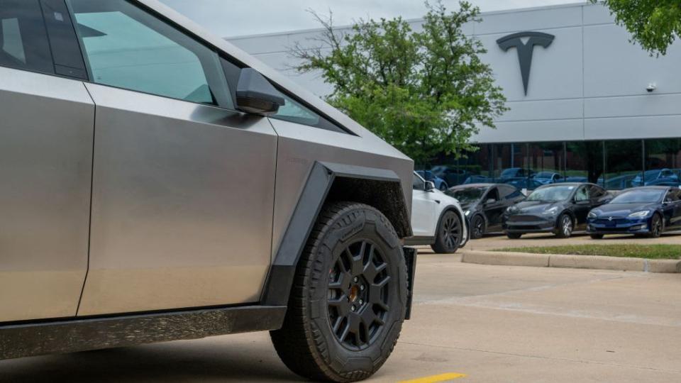 tesla cybertruck in a parking lot