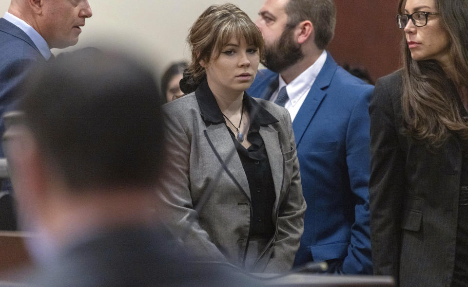 Defendant Hannah Gutierrez-Reed, former armorer on the set of the movie "Rust", walks back to her seat after speaking with District Judge Mary Marlowe Sommer before her trial at District Court, Monday, Feb. 26, 2024, in Santa Fe, N.M. Gutierrez-Reed is charged with involuntary manslaughter and tampering with evidence in the October 2021 death of cinematographer Halyna Hutchins during the filming of the Western. (Luis Sánchez Saturn0/Santa Fe New Mexican via AP, Pool)