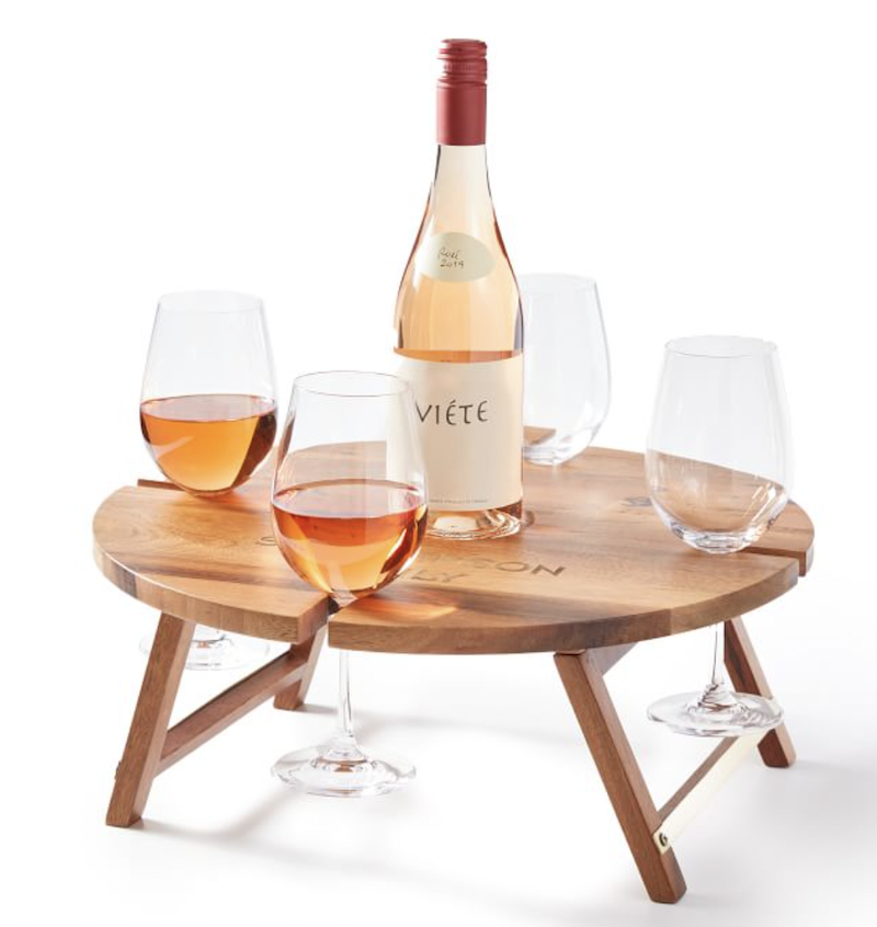 <p><a href="https://go.redirectingat.com?id=74968X1596630&url=https%3A%2F%2Fwww.markandgraham.com%2Fproducts%2Farjun-wood-portable-wine-picnic-table%2F%3FcatalogId%3D34%26sku%3D3444607%26cm_ven%3DPLA%26cm_cat%3DGoogle%26cm_pla%3DEntertaining%2B%253E%2BServeware%2B%252B%2BCheese%2BBoards%26region_id%3D669950%26cm_ite%3D3444607_17389899546_Pmax%26gclid%3DCj0KCQiA7bucBhCeARIsAIOwr-_rbGlQb_3jM_DnE38awEZEi2WnffDQRnB5AxOL-edlDLid4asAfykaAmzQEALw_wcB&sref=https%3A%2F%2Fwww.esquire.com%2Flifestyle%2Fg12788830%2Fgifts-for-wine-lovers%2F" rel="nofollow noopener" target="_blank" data-ylk="slk:Shop Now;elm:context_link;itc:0;sec:content-canvas" class="link ">Shop Now</a></p><p>Wood Portable Wine Picnic Table</p><p>markandgraham.com</p><p>$69.99</p>