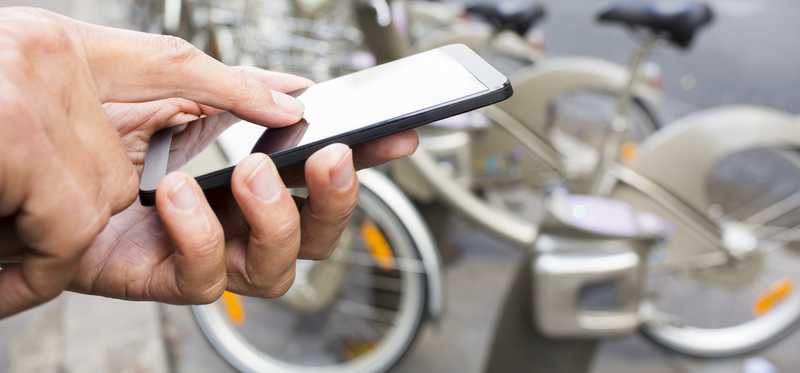 A man checks out a smart bike.