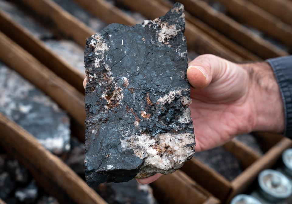 Geologist Matthew Banaszynski holds a manganese sample in the core processing facility, May 30, 2023, at the Hermosa Mine, near Patagonia.