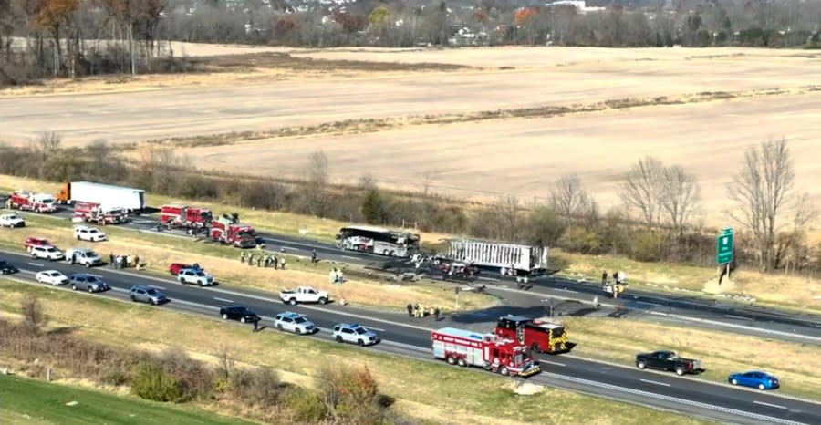 Emergency responders are on the scene of a fatal accident on Interstate 70 West in Licking County, Ohio, Tuesday, Nov. 14, 2023. An emergency official says a charter bus carrying students from a high school was rear-ended by a semi-truck on the Ohio highway. (WSYX/WTTE via AP)