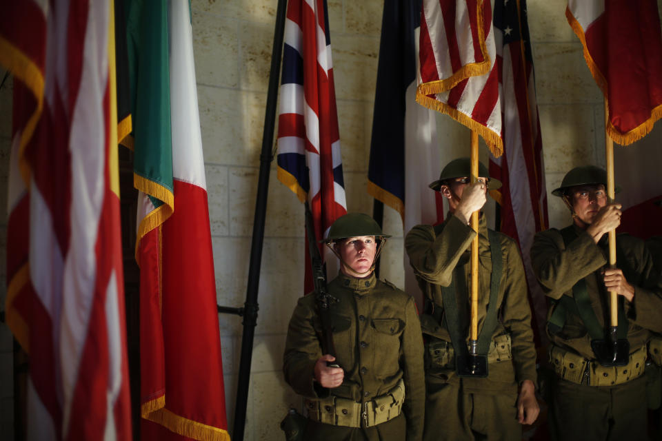 American soldiers wearing WWI military uniforms attend a remembrance ceremony in the Meuse-Argonne cemetery, northeastern France, Sunday, Sept. 23, 2018. A remembrance ceremony is taking place Sunday for the 1918 Meuse-Argonne offensive, America's deadliest battle ever that cost 26,000 lives but helped bringing an end to World War 1. (AP Photo/Thibault Camus)