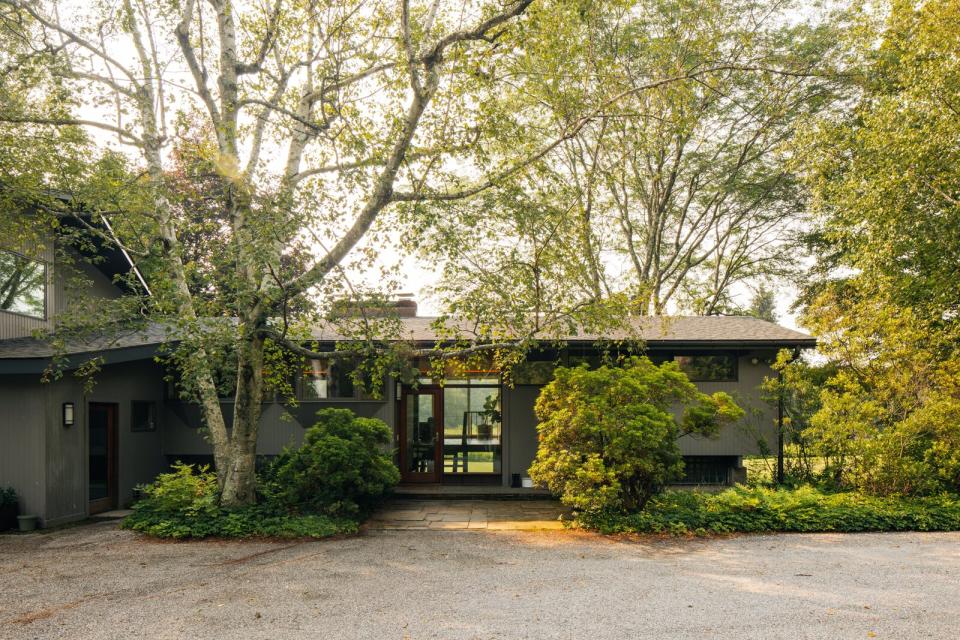 Nestled next to a meadow of wildflowers, the wood-clad home presents a peaceful city escape all while being less than a one-and-a-half hours' drive from Downtown Manhattan.