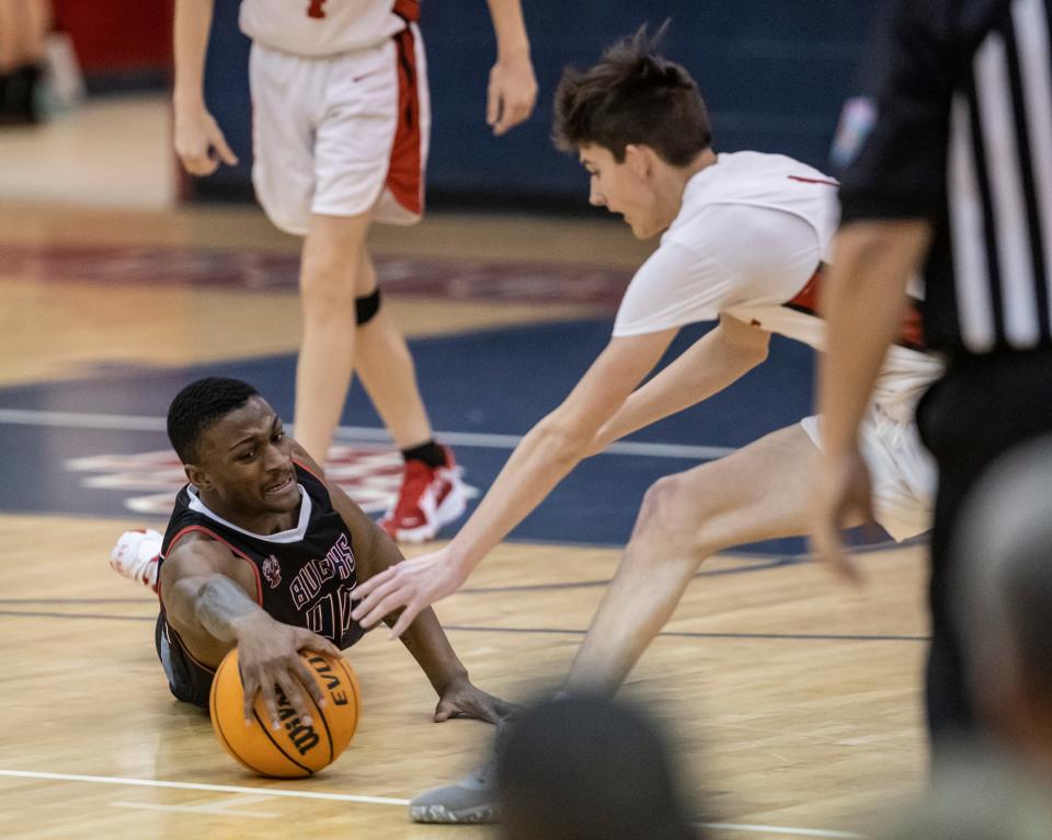 Bozeman guard Lewis Lowder scrambles for a loose ball ahead of Pirate Isaac Spooner. Bozeman hosted Ponce De Leon High School in boys basketball Thursday, January 20, 2022.