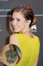 Audrina Patridge explained the meaning behind her tattoo which is on the back of her neck. She said, "My tattoo is a heart with four chambers that turns into an apple with a snake around it. It symbolizes the story of Adam and Eve... and also temptation and destiny."