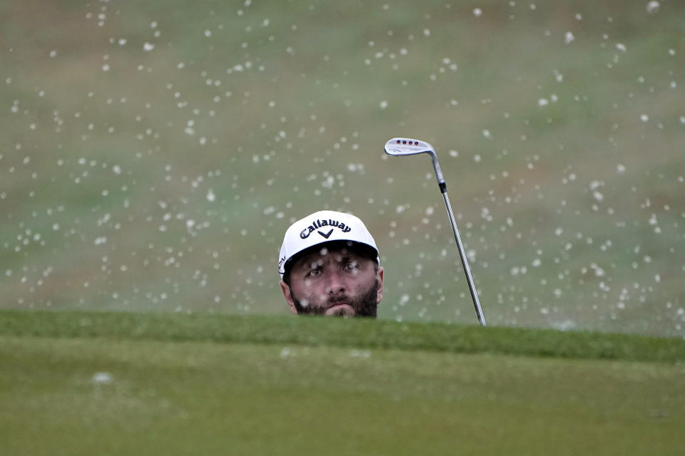 Jon Rahm, of Spain, watches his shot from a bunker on the 18th hole during a practice round for the Dell Technologies Match Play Championship golf tournament in Austin, Texas, Tuesday, March 21, 2023. (AP Photo/Eric Gay)