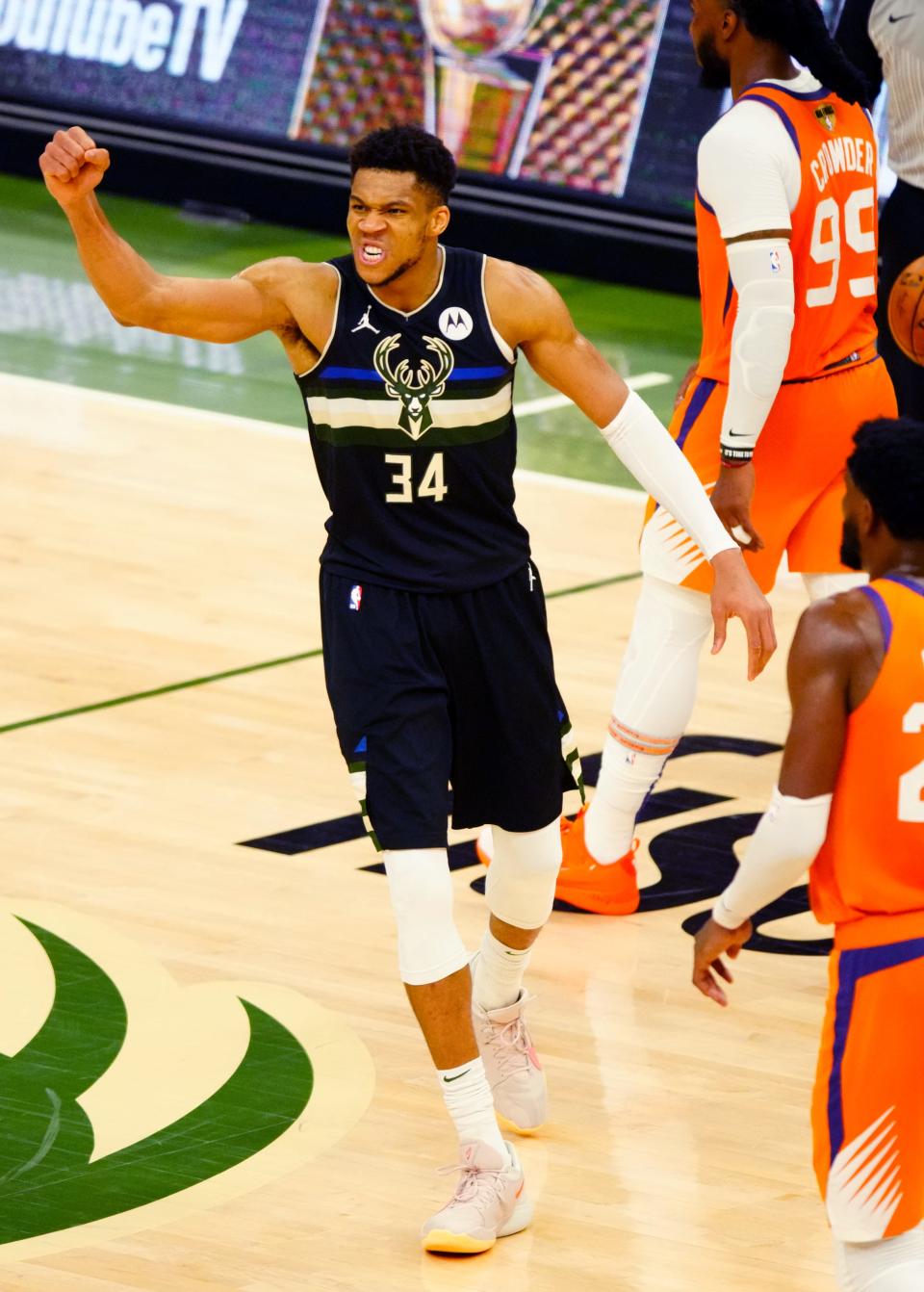 Giannis Antetokounmpo celebrates during the Bucks' Game 6 win over the Suns.