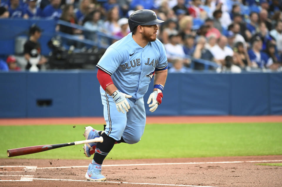 Toronto Blue Jays' Alejandro Kirk heads to first with a single off Tampa Bay Rays pitcher Ryan Yarbrough during the second inning of a baseball game Thursday, June 30, 2022, in Toronto. (Jon Blacker/The Canadian Press via AP)