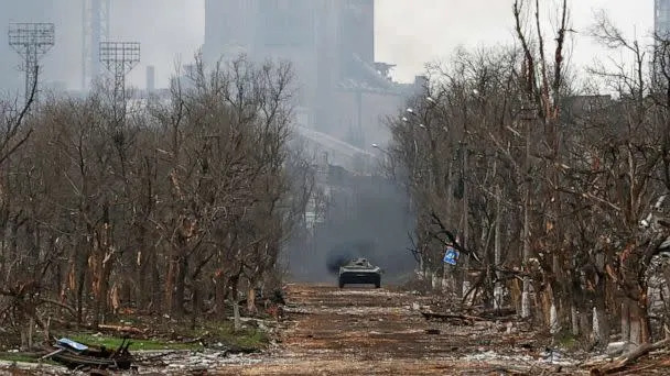 PHOTO: An armored vehicle of pro-Russian troops drives along a street during fighting near an iron and steel plant in the southern port city of Mariupol, Ukraine, April 12, 2022. (Alexander Ermochenko/Reuters)