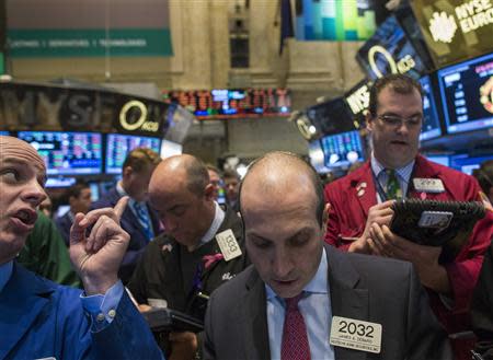 Traders work on the floor of the New York Stock Exchange December 11, 2013. REUTERS/Brendan McDermid