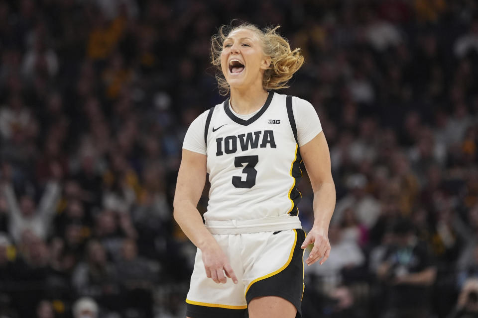 Iowa guard Sydney Affolter (3) celebrates after making a 3-point basket during the second half of an NCAA college basketball quarterfinal game against Penn State at the Big Ten women's tournament Friday, March 8, 2024, in Minneapolis. (AP Photo/Abbie Parr)