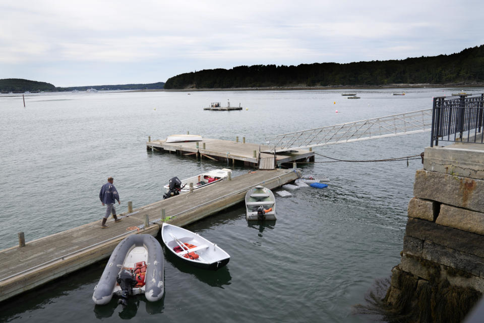 Lobsterman Bruce Young heads for home after hauling his fishing boat and skiff out of the water in advance of Hurricane Lee, Friday, Sept. 15, 2023, in Bar Harbor, Maine. Fishermen in the area are moving their boats to safety before Saturday's storm. (AP Photo/Robert F. Bukaty)