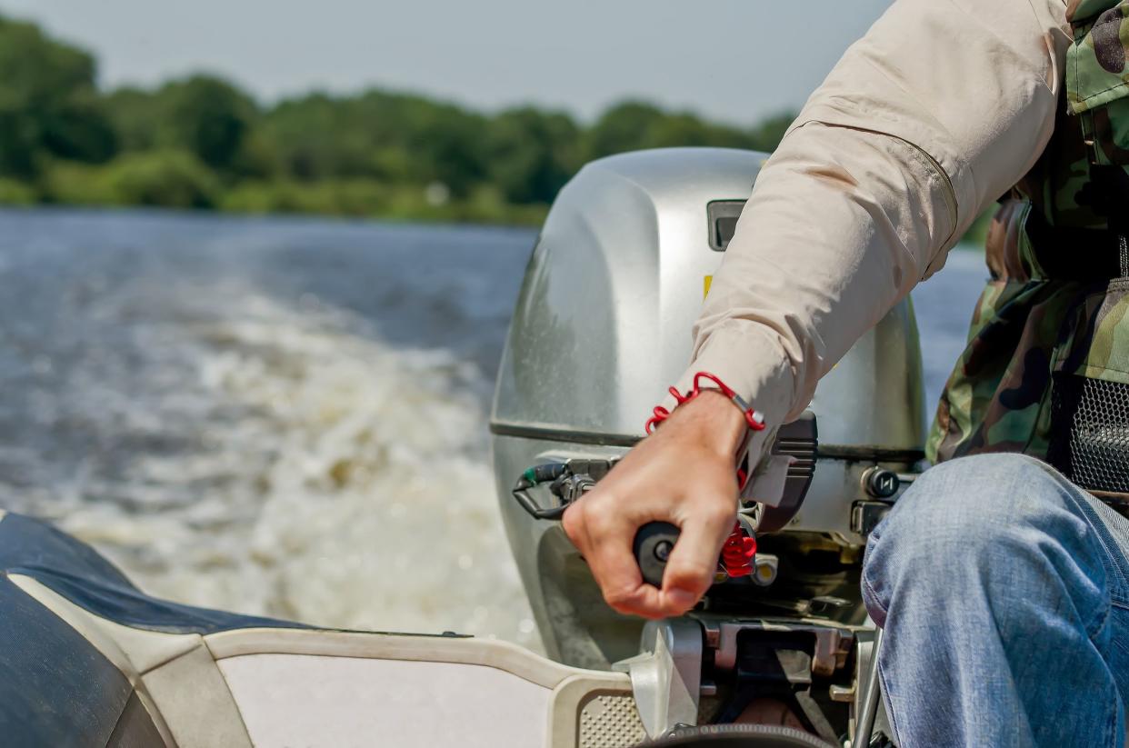 A man drives a motor boat. Speed boat.