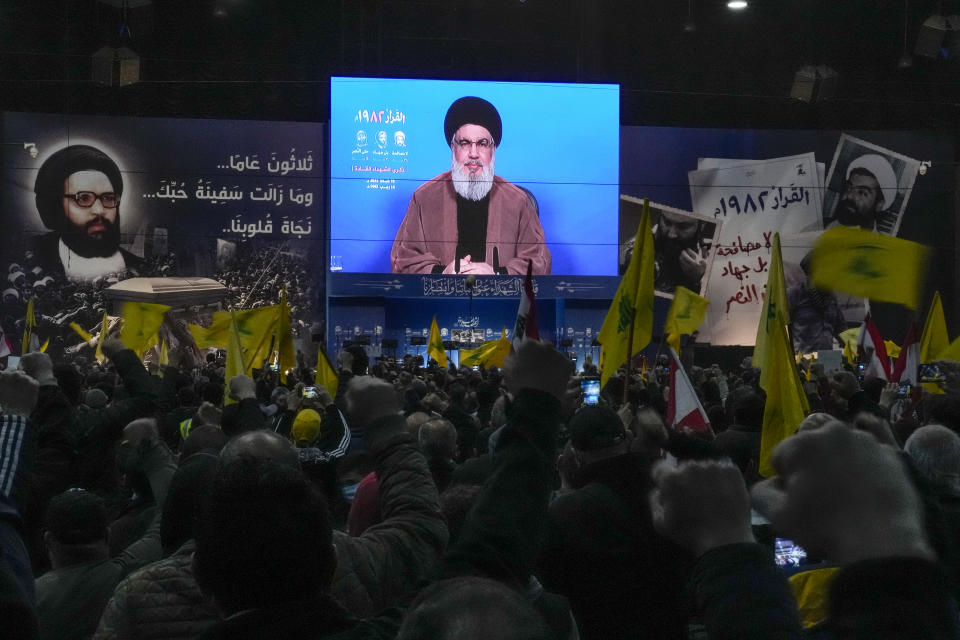 FILE - Hezbollah leader Sheik Hassan Nasrallah speaks via a video link during an annual ceremony commemorating the killing of some of the Iran-backed group's top political and military leaders, in the southern suburb of Beirut, Lebanon, Feb. 16, 2022. While American influence has waned, Russia has made powerful friends, from Shiite militias in Iraq, to Lebanon’s Hezbollah group, to Houthi rebels in Yemen. Largely because of his Syria military intervention, they see Putin as a steady, reliable partner who unlike the Americans does not drop his allies. (AP Photo/Hassan Ammar, File)