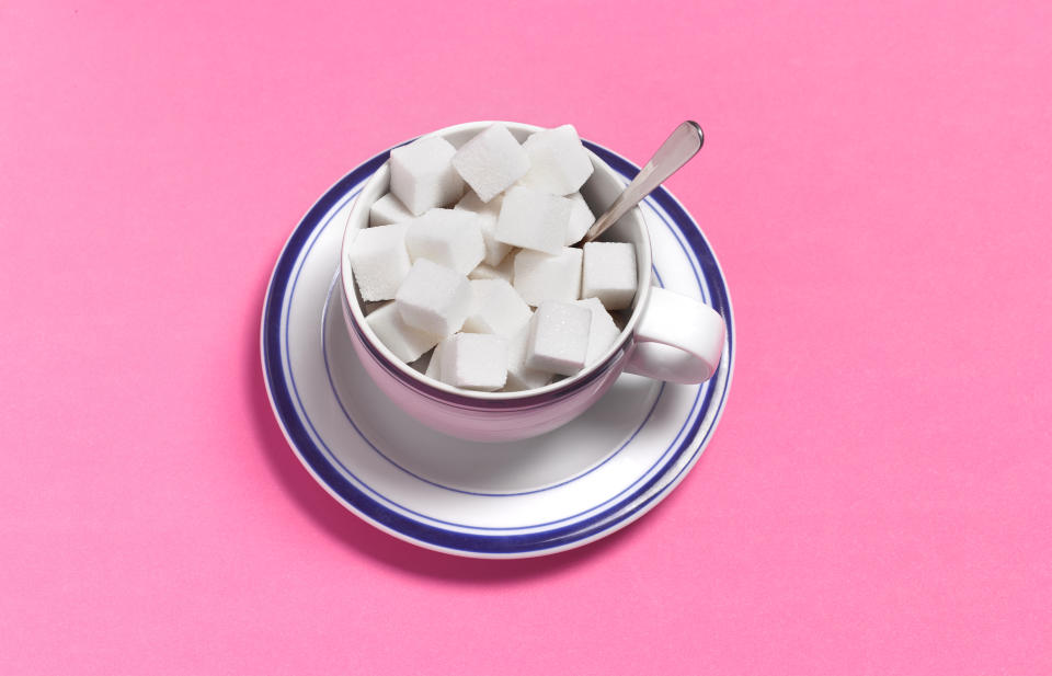 Even if you don’t think you add a lot of sugar to your coffee, the trouble is when it adds up after multiple cups per day. (Photo: Peter Dazeley via Getty Images)